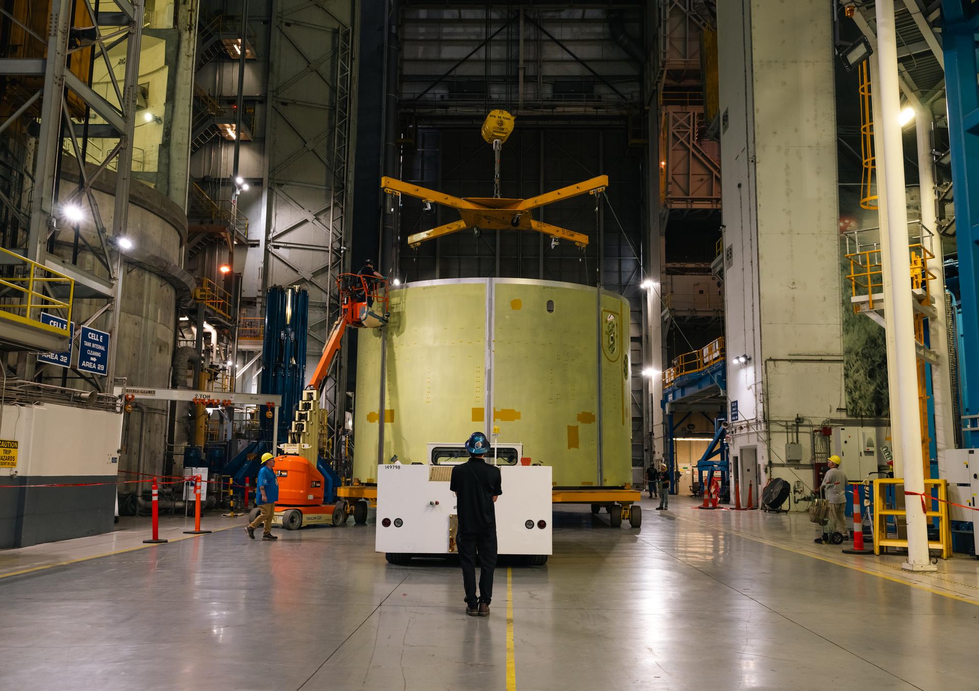 Teams at Michoud Assembly Facility in New Orleans load the engine section barrel into the vertical assembly center on Aug. 5, 2026. The engine section will be used on the SLS (Space Launch System) rocket’s core stage for the agency’s Artemis V mission. On the vertical assembly center tooling, teams will mate the flight hardware to a ring, which will serve as an attachment point for the liquid hydrogen tank later in the production process. The engine section is one of five major elements that make up the 212-foot-tall SLS rocket stage; and houses various avionic systems, the engine thrust structure, and four RS-25 engines. The core stage produces more than two million pounds of thrust to help launch NASA’s Orion spacecraft, astronauts, and supplies beyond Earth’s orbit and to the lunar surface for Artemis.